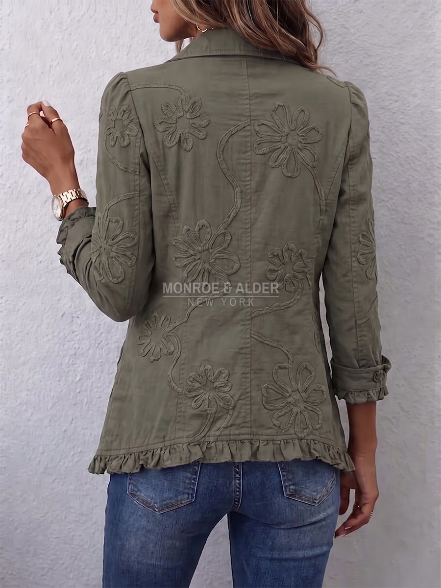 Darlene jacket in Olive Green, back view showing the embroidery and ruffled hem