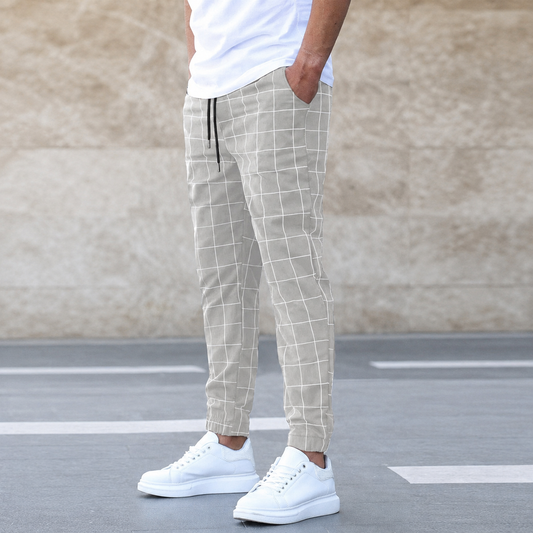 Hayes checkered jogger pants in light gray, worn with a white tee and white sneakers