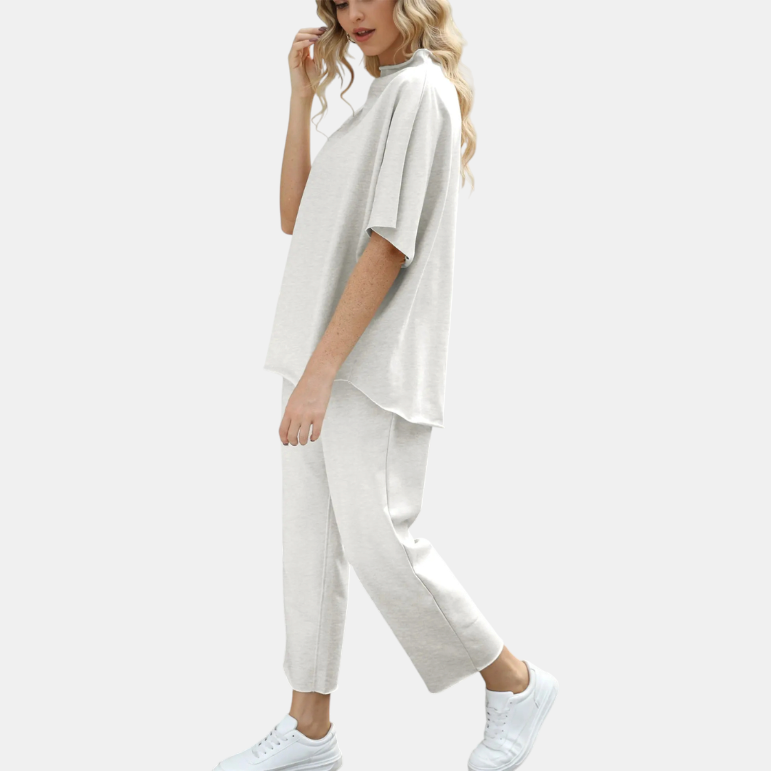 Side view of the Stella set in light gray, showing the drape of the wide-leg cropped trousers