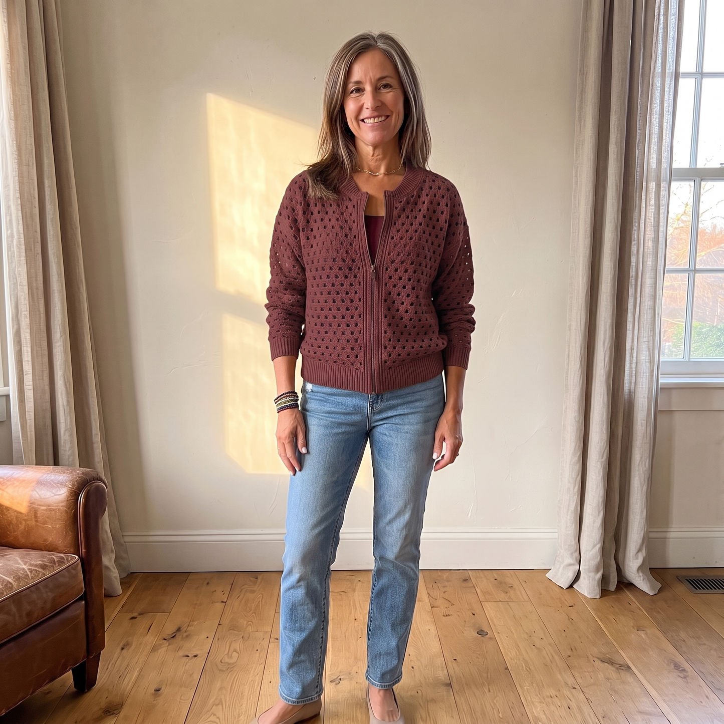 Yvette knitted cardigan in Burgundy, full look with jeans in warm afternoon light