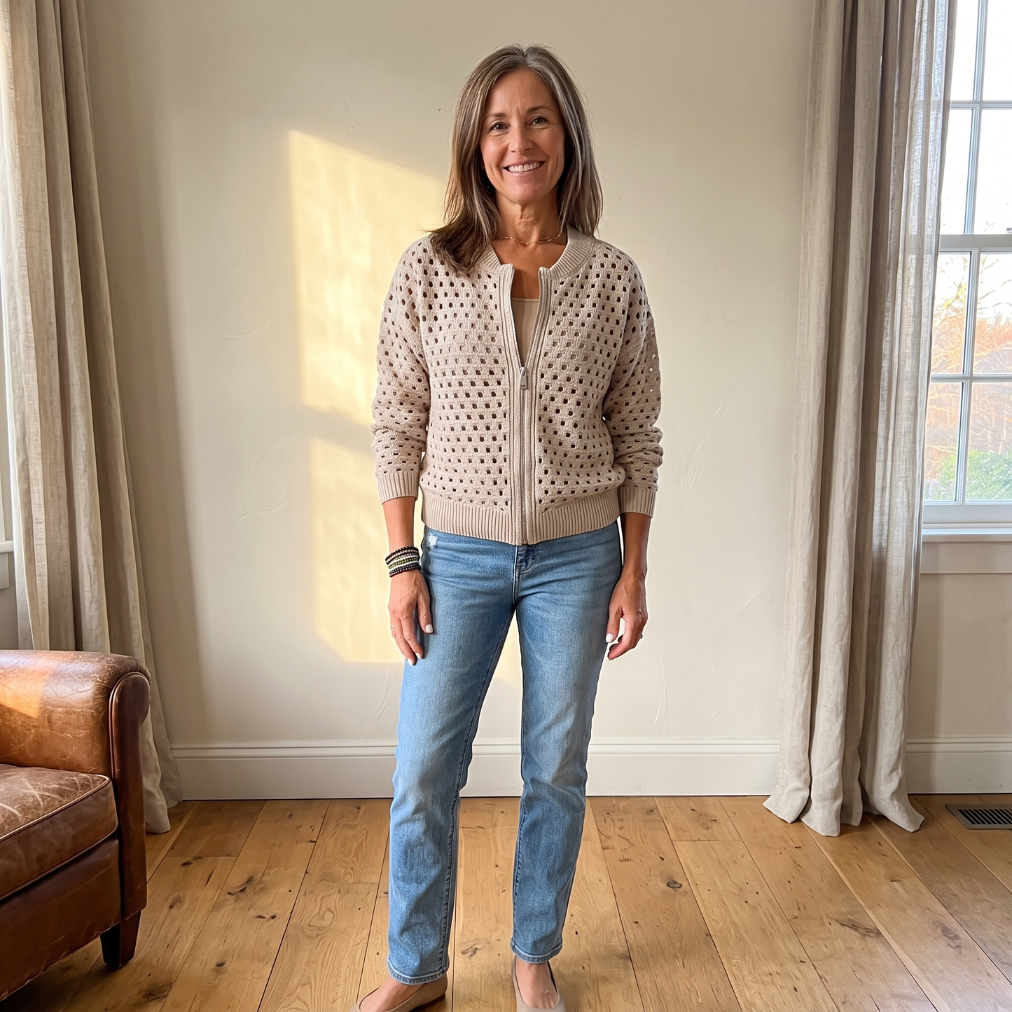 Yvette knitted cardigan in Beige, full look with jeans in warm afternoon light