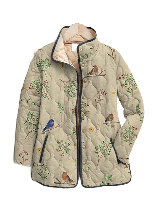Violet quilted jacket in a birdsong and branch print, front view