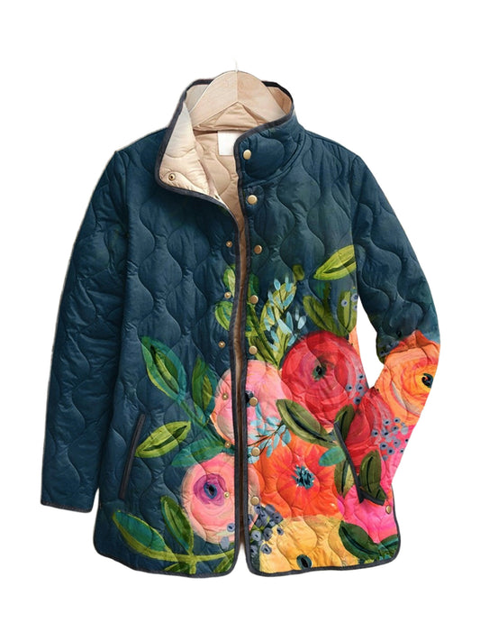 Isadora quilted jacket in a painted garden floral on deep teal, front view