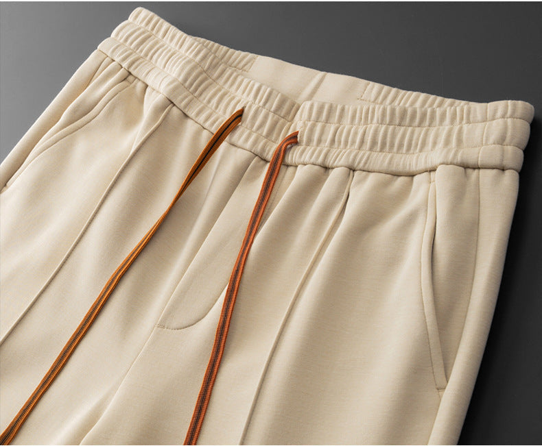 Close view of the side pocket and front crease on the pants