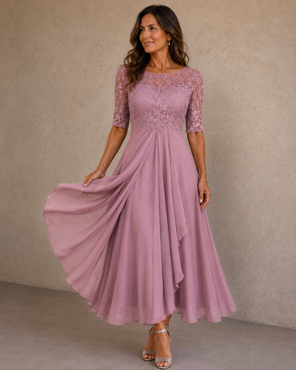 Elaine chiffon dress in Dusty Pink, full front view with the skirt caught mid-movement