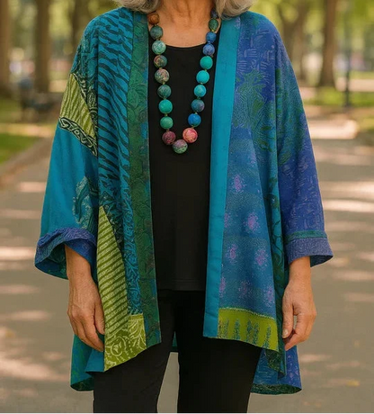 Blanche drape cardigan in Teal Blue, worn open over a black top and black pants