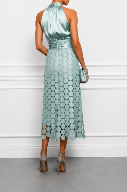Back view of the Vera midi dress showing the open back, draped waistband and scalloped disc hem