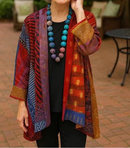 Blanche drape cardigan in Rust Red, worn open over a black top and black pants