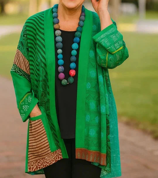 Blanche drape cardigan in Green, worn open over a black top and black pants