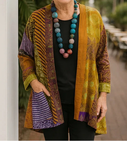 Blanche drape cardigan in Mustard, styled over black basics with one hand at the side