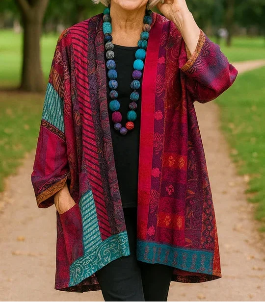 Blanche drape cardigan in Magenta, worn open over a black top and black pants