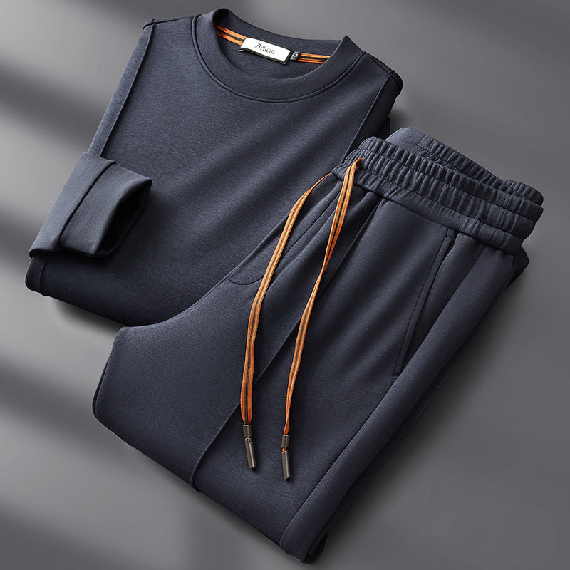 Wade cotton-silk set in navy, sweatshirt and pants folded flat