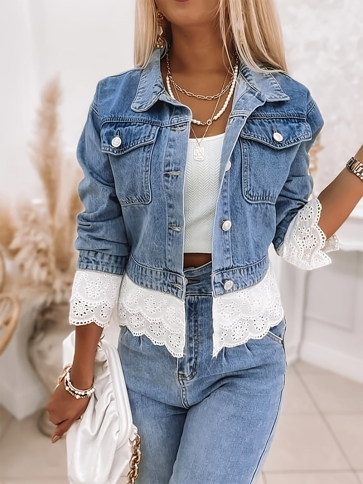 Winnie cropped denim jacket front view, lace hem falling below the denim waistband