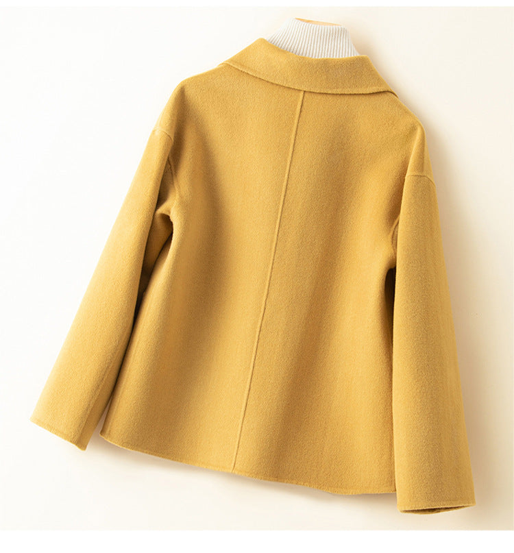 Back view of the Myrna cashmere crop coat, showing the center seam and drop shoulders
