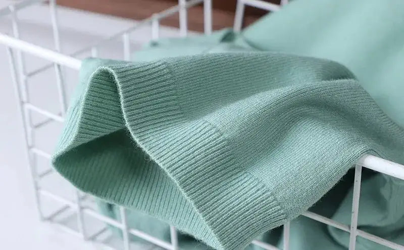 Close view of the ribbed sleeve trim on the sage green Warren knit t-shirt