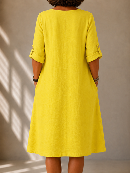 Back view of the Leona dress in Yellow, showing the straight A-line drape