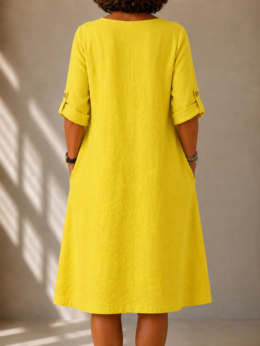 Back view of the Leona dress in Yellow, showing the straight A-line drape