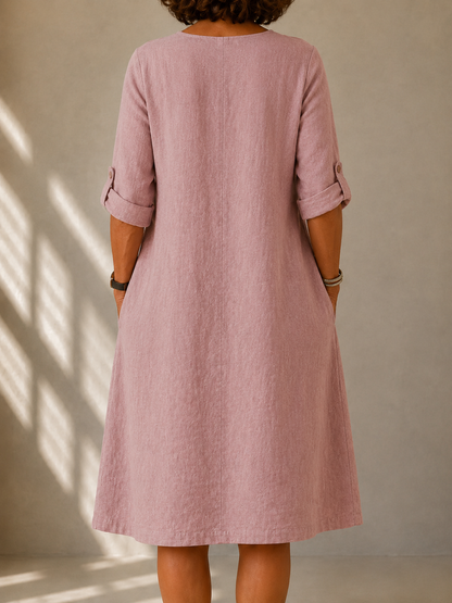 Back view of the Doris dress in Dusty Pink, showing the A-line drape