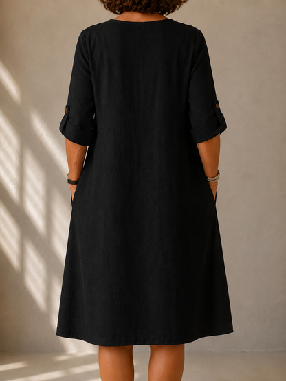 Back view of the Gloria dress in Black, showing the straight A-line drape
