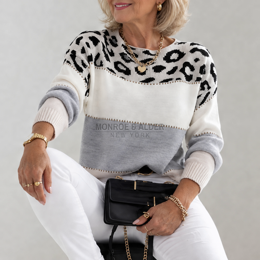 Carolyn leopard colorblock knit sweater in Cream & Gray, worn with white jeans