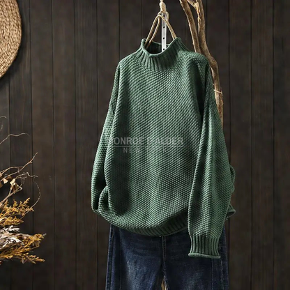 Esther sweater in dark green on a hanger, textured knit and ribbed mock neck