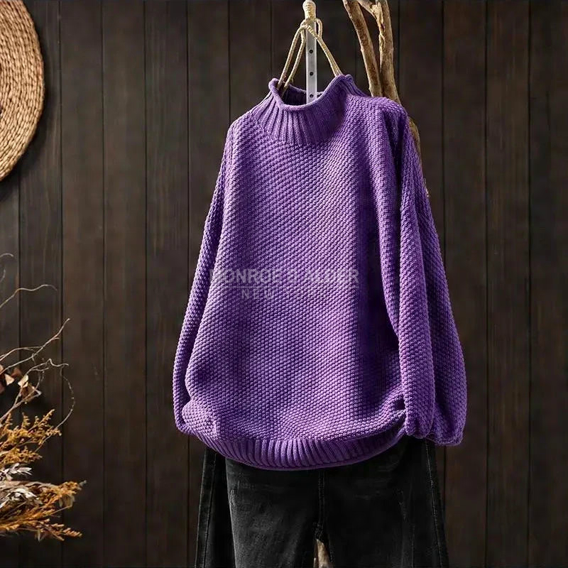 Esther sweater in purple on a hanger