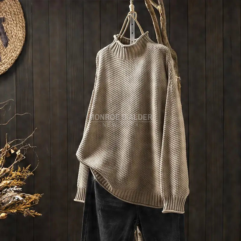 Esther sweater in taupe on a hanger