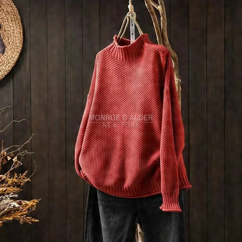 Esther sweater in red on a hanger