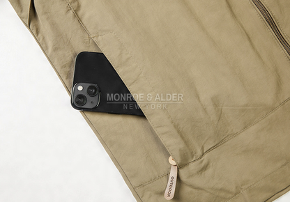 Close view of the zippered side pocket holding a phone