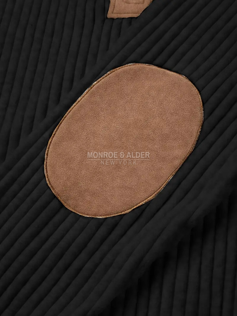 Close view of the suede-look elbow patch on the ribbed knit