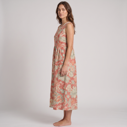 Charlotte sleeveless midi dress in coral floral, side view showing the dropped waist and side-seam pocket