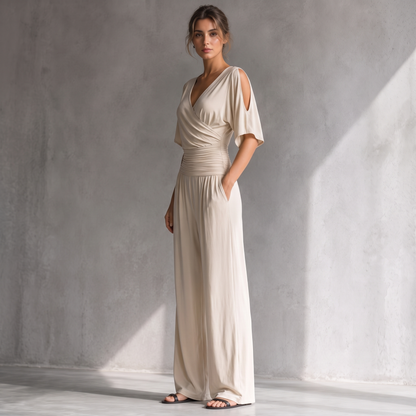 Georgia beige jumpsuit, side view showing the ruched waist and side pocket