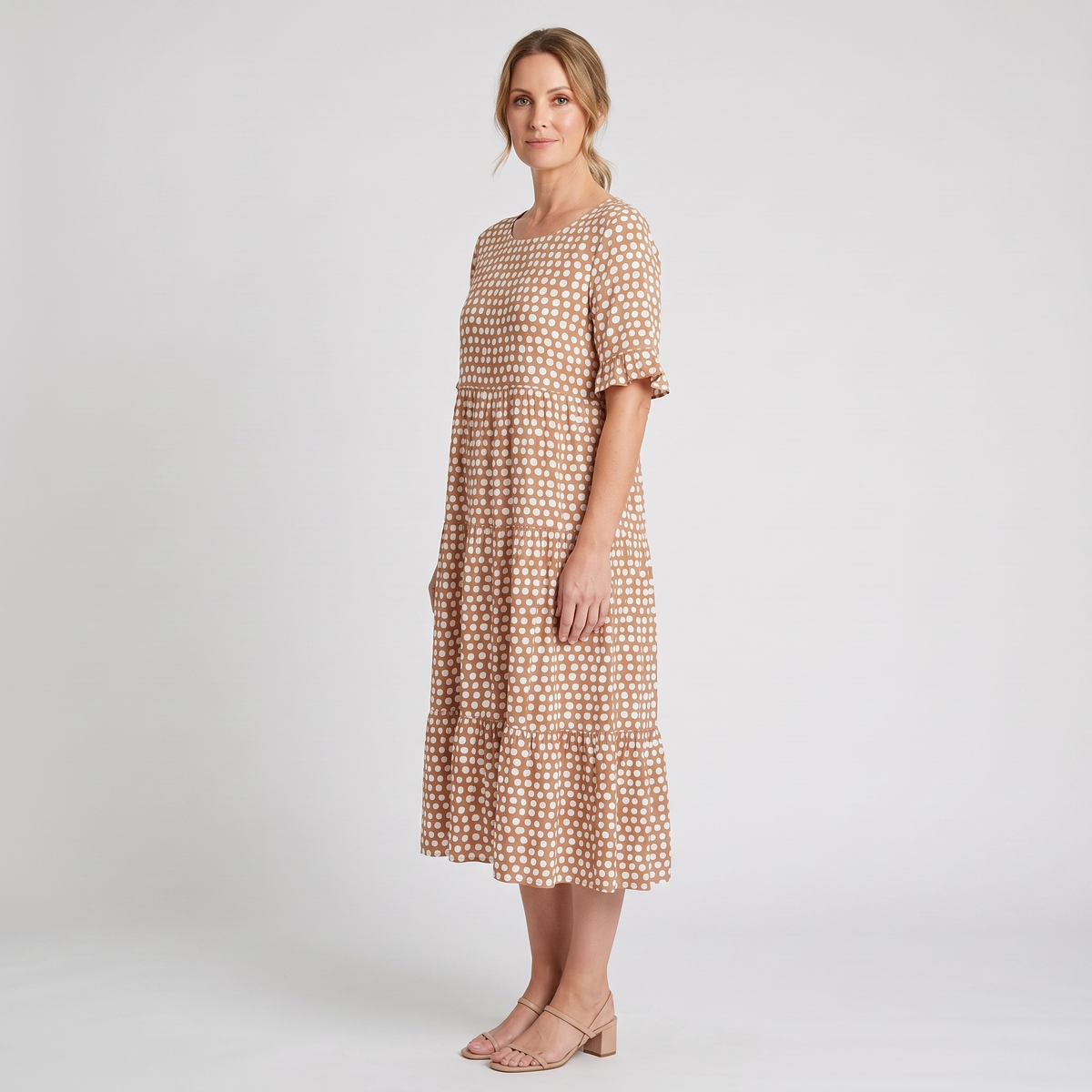 Sutton short-sleeve polka dot midi dress in camel, side view showing the three-tier skirt