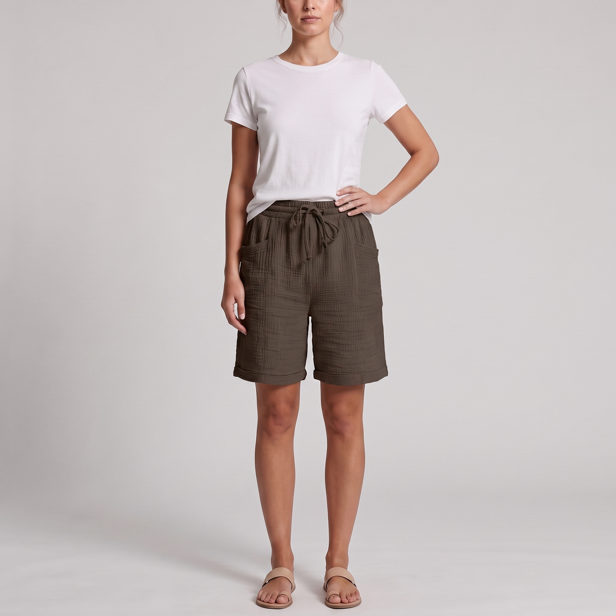 Woman wearing Josie brown crinkle cotton bermuda shorts with a white tee