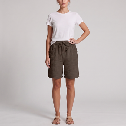 Woman wearing Josie brown crinkle cotton bermuda shorts with a white tee