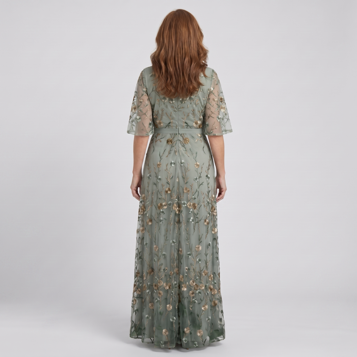 Nora sage green floral maxi dress, back view showing the embroidered mesh and waist tie