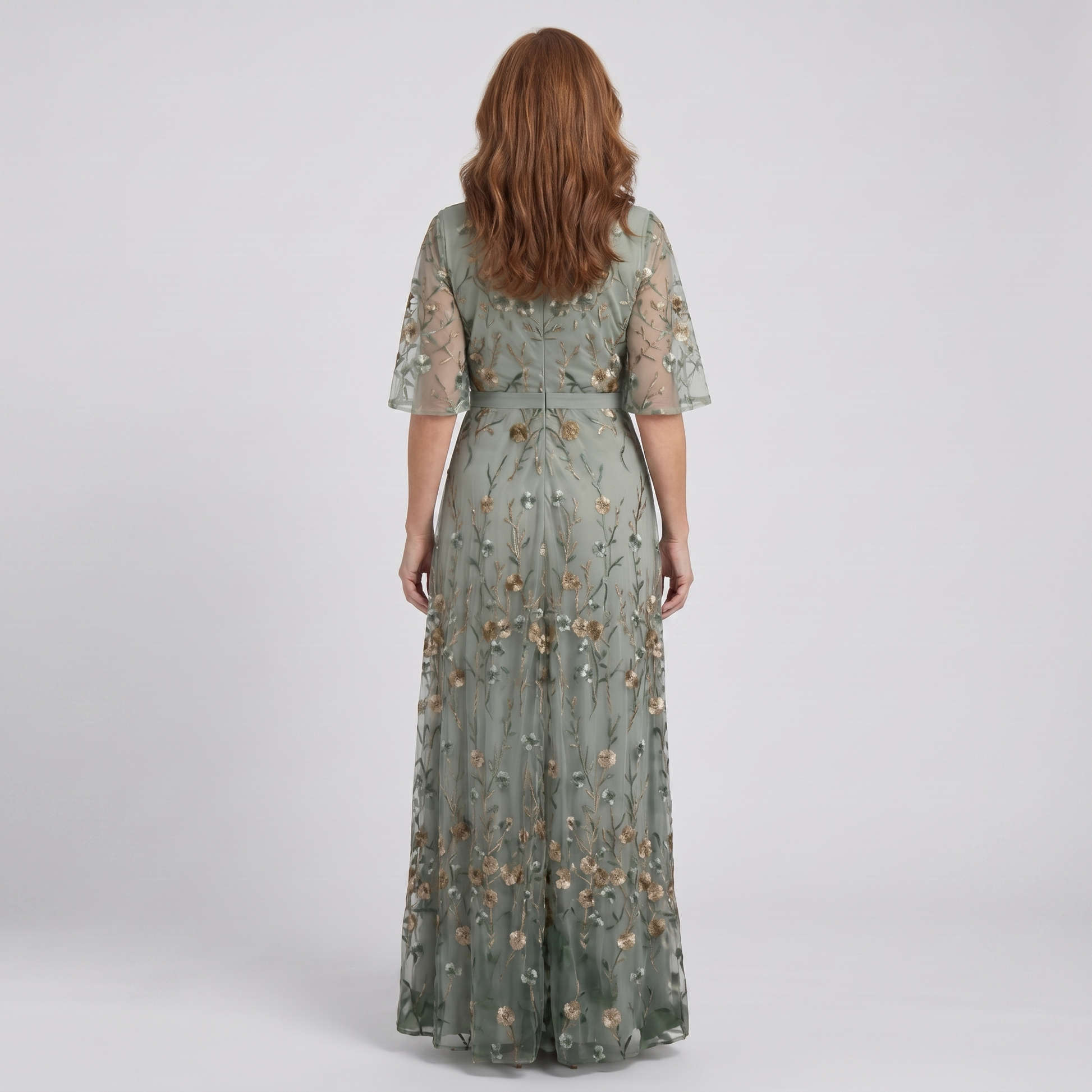 Nora sage green floral maxi dress, back view showing the embroidered mesh and waist tie