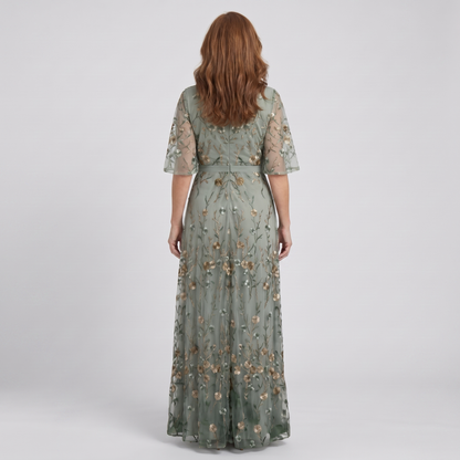Nora sage green floral maxi dress, back view showing the embroidered mesh and waist tie