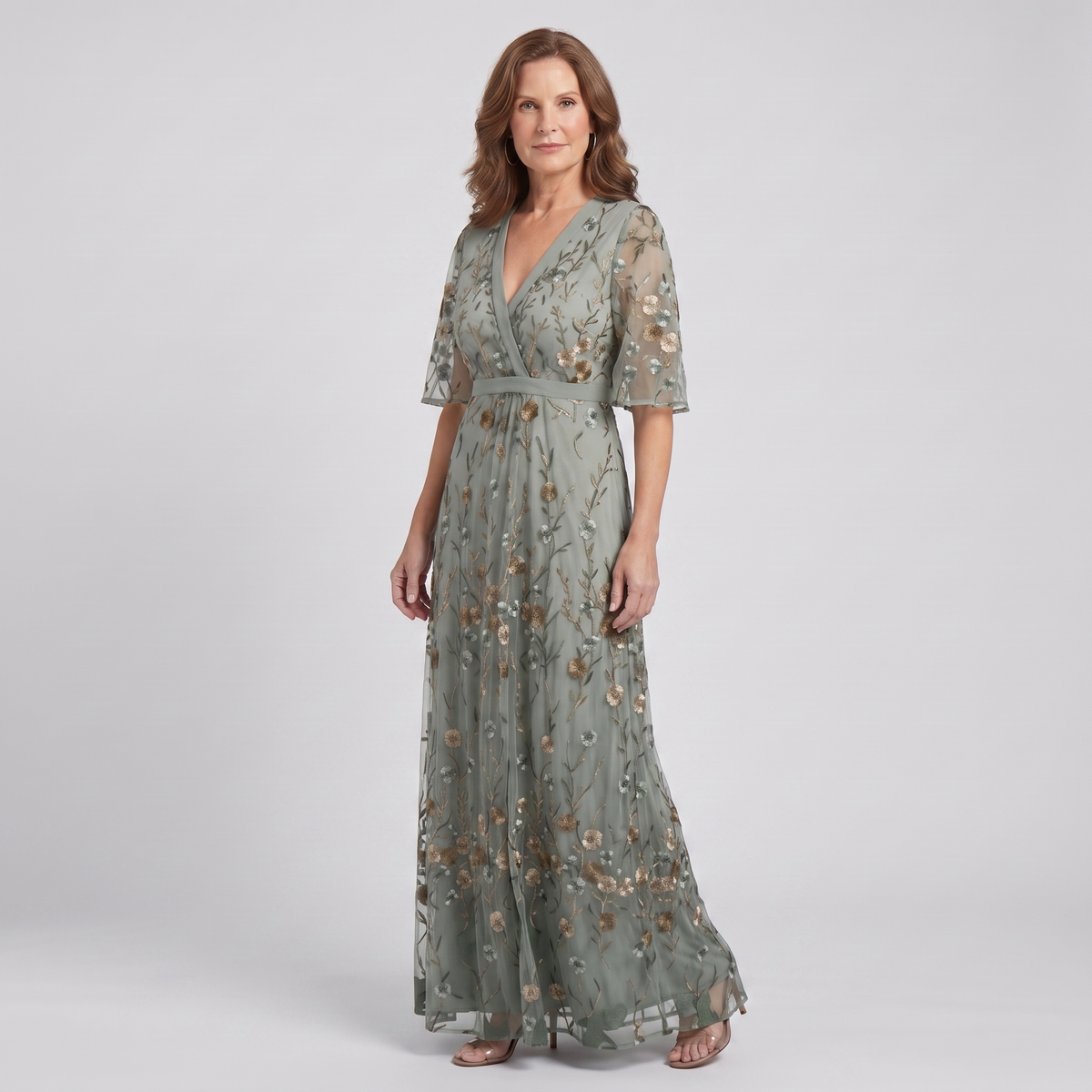 Nora sage green floral maxi dress, three-quarter view showing the defined waist and flowing skirt