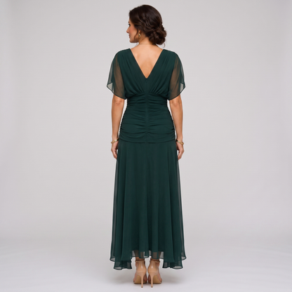 Clara dark green chiffon maxi party dress, back view with deep V back and ruched waist