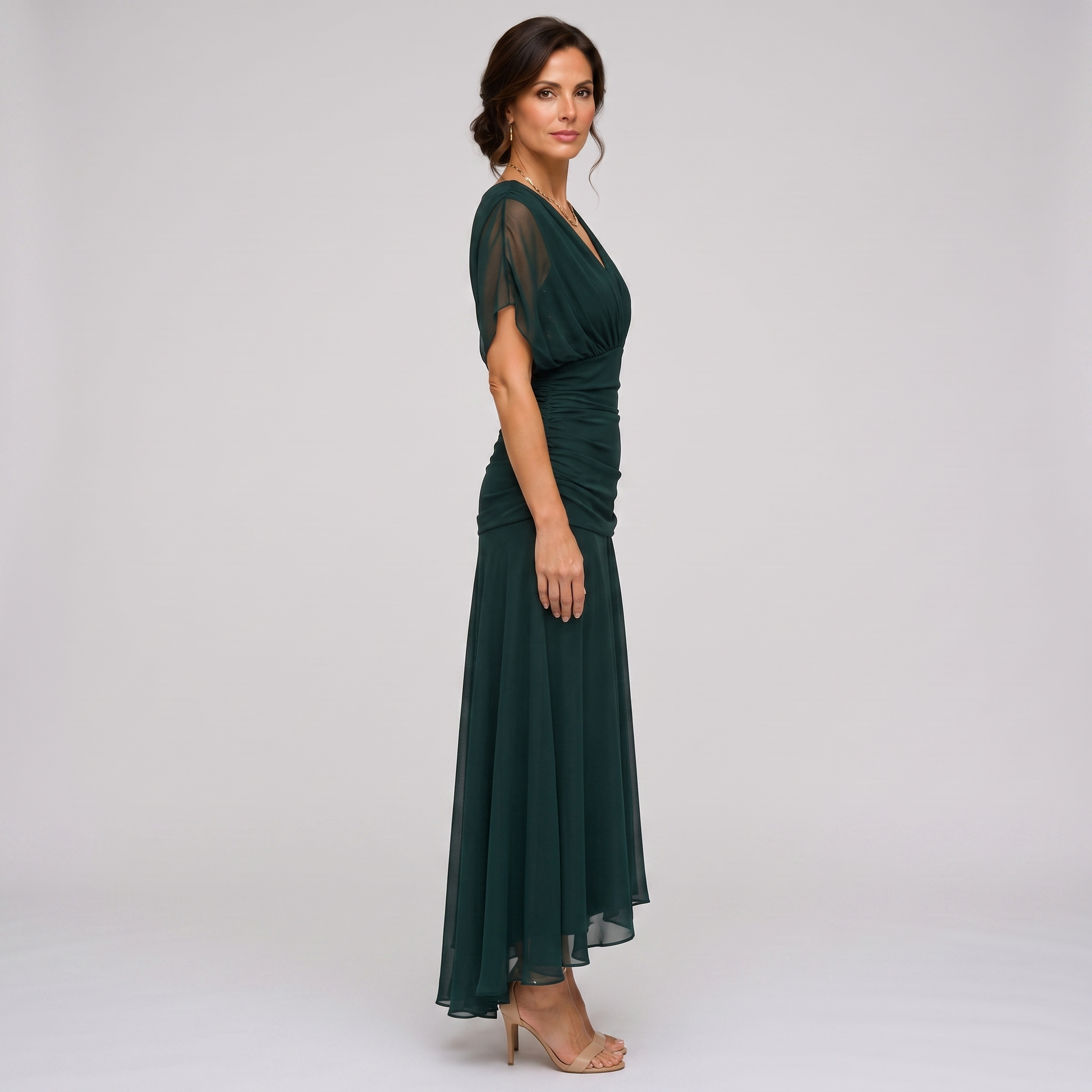 Clara dark green chiffon maxi party dress, side view showing the high-low hem