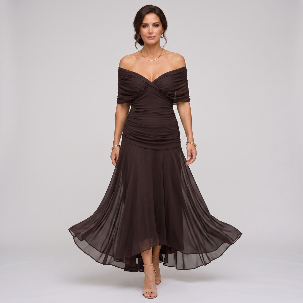 Clara dark brown chiffon maxi party dress worn off the shoulder, walking front view