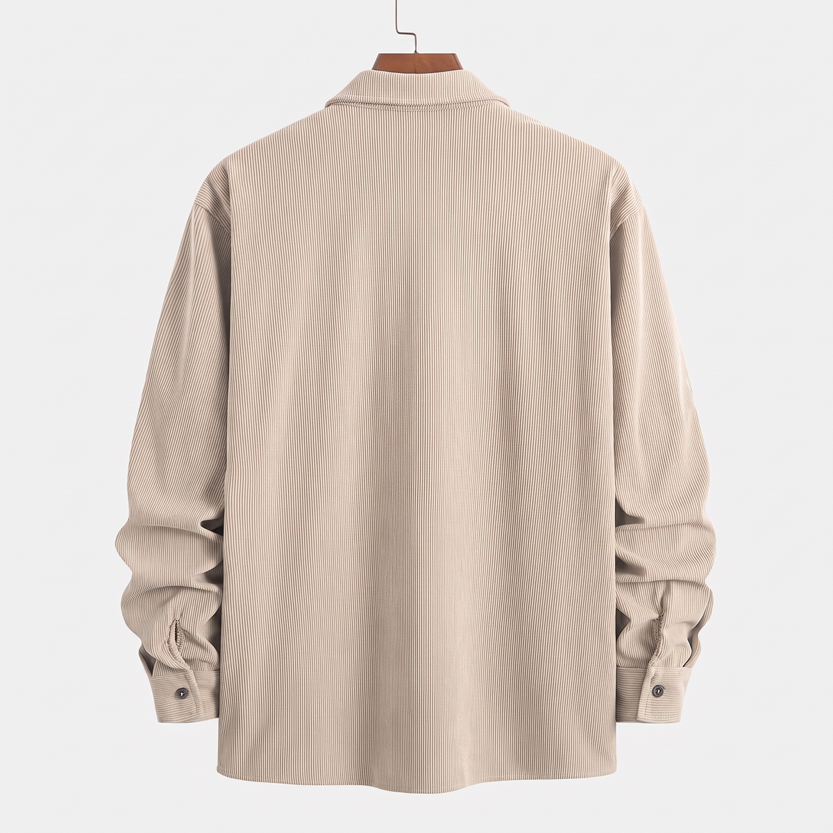 Back view of the Brooks beige corduroy overshirt on a hanger against a white background