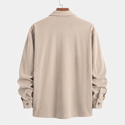 Back view of the Brooks beige corduroy overshirt on a hanger against a white background