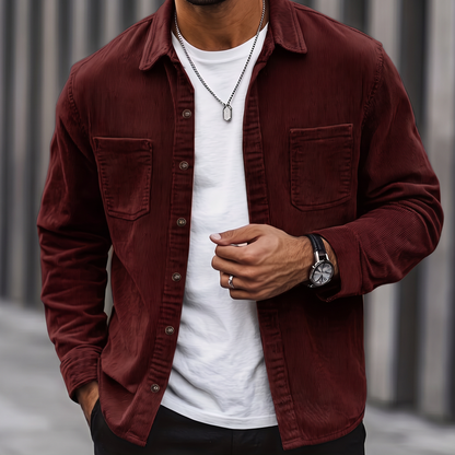Man wearing the Brooks burgundy corduroy overshirt over a white tee, cropped torso view