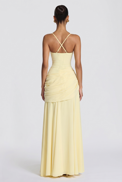 Genevieve maxi dress in butter yellow, back view showing the crossed adjustable straps