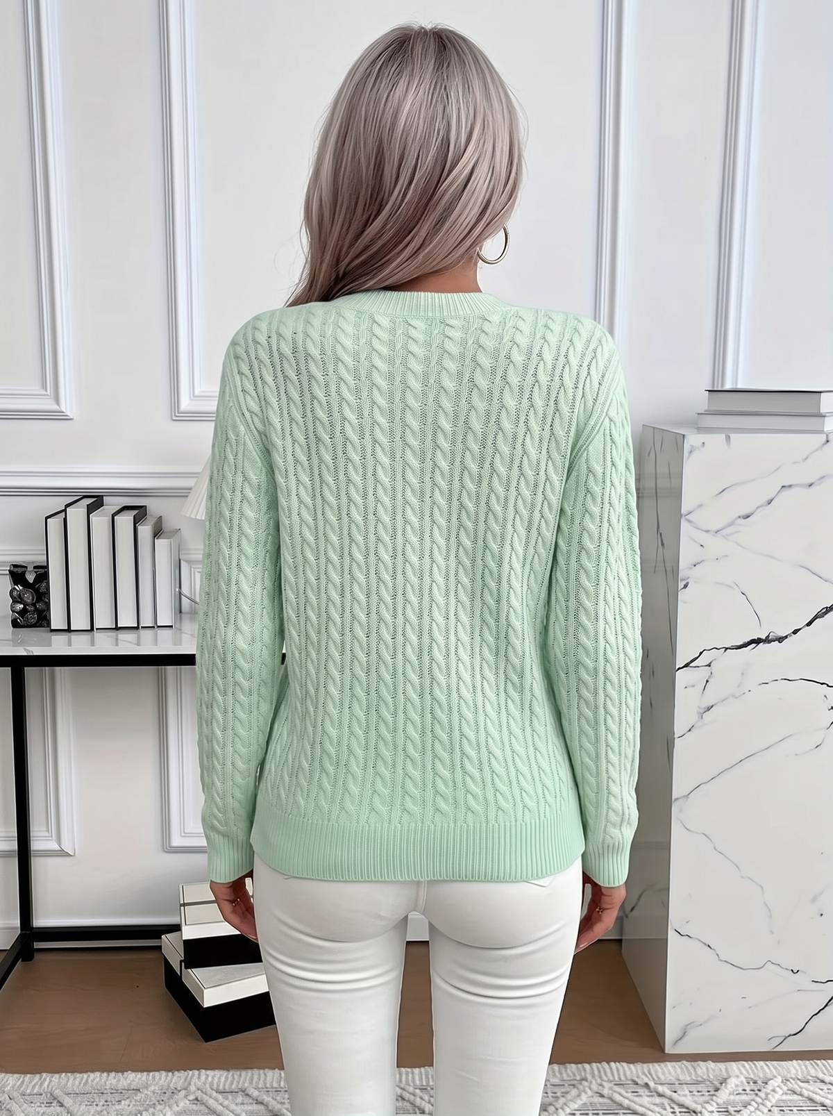 Back view of the Evelyn cozy cable knit sweater in mint green