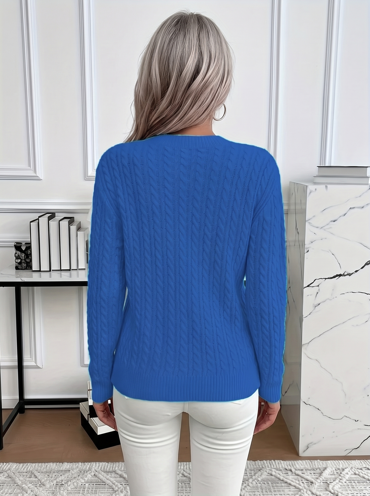 Back view of the Evelyn cozy cable knit sweater in royal blue