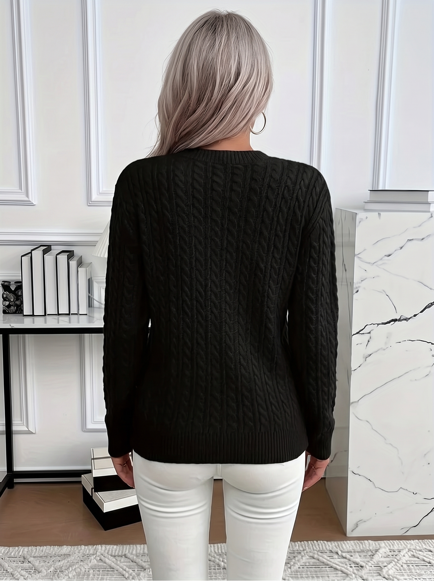 Back view of the Evelyn cozy cable knit sweater in black