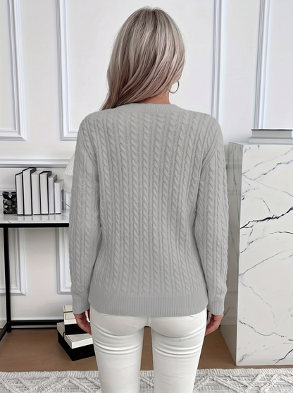 Back view of the Evelyn cozy cable knit sweater in light gray